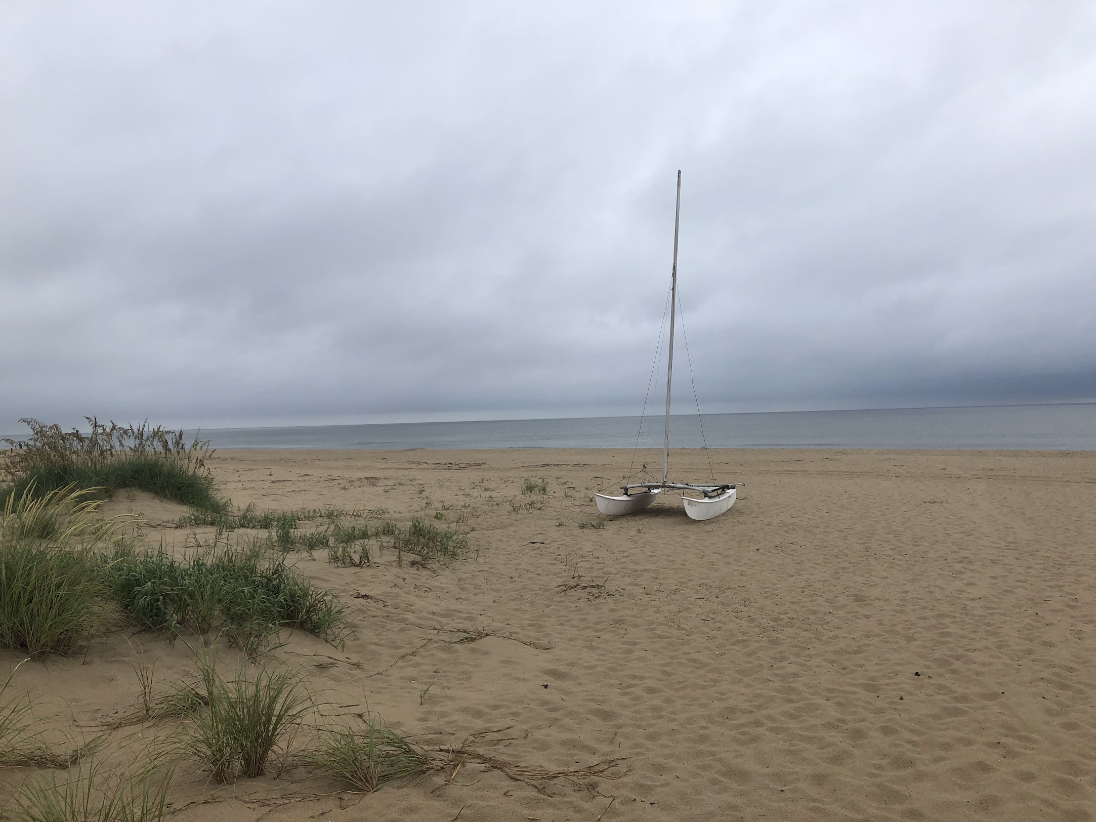 Catamaran on Sandbridge Beach on an overcast day